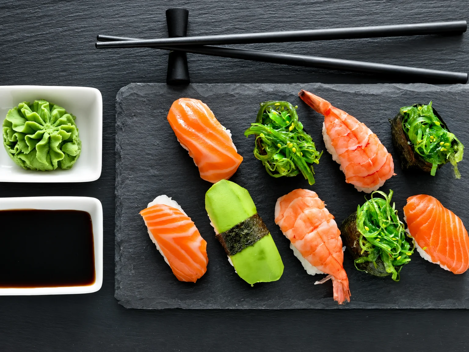 Sushi on a dark platter · illustration